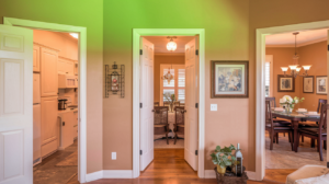 A hallway with multiple doorways showcasing the open floor plan of a modern home.