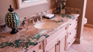 A luxurious bathroom vanity with a beautiful granite countertop, showcasing intricate veining and a decorative vase.